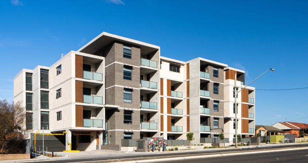 Wide five story building shown from the street