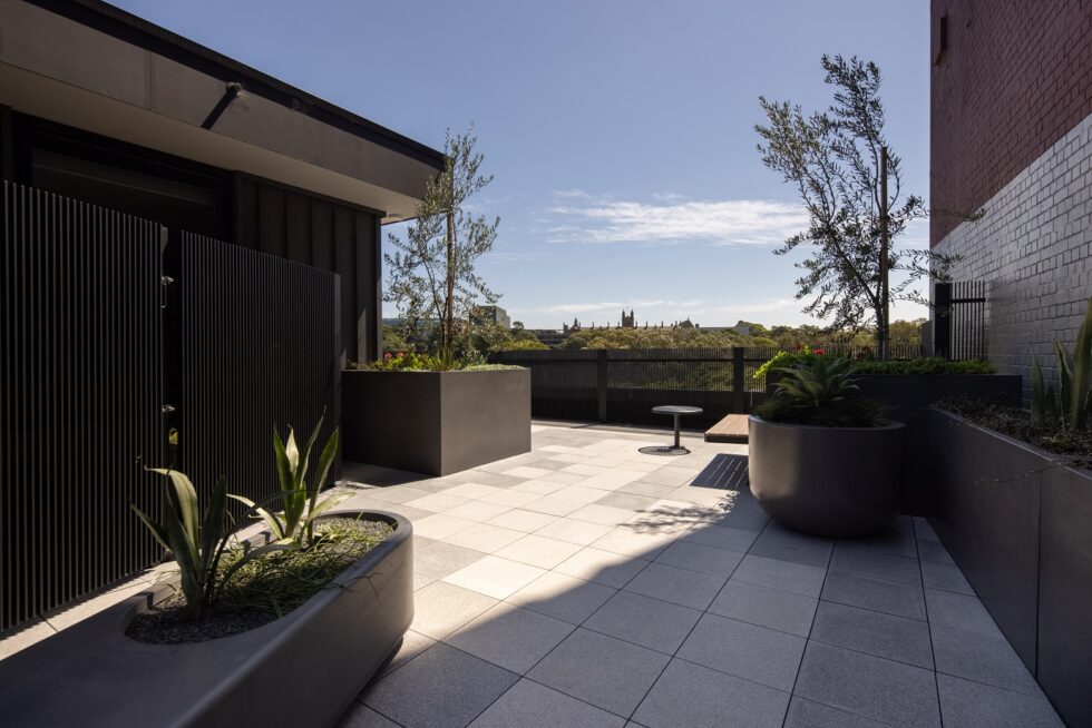 Rooftop garden and community area with view overlooking the suburbs
