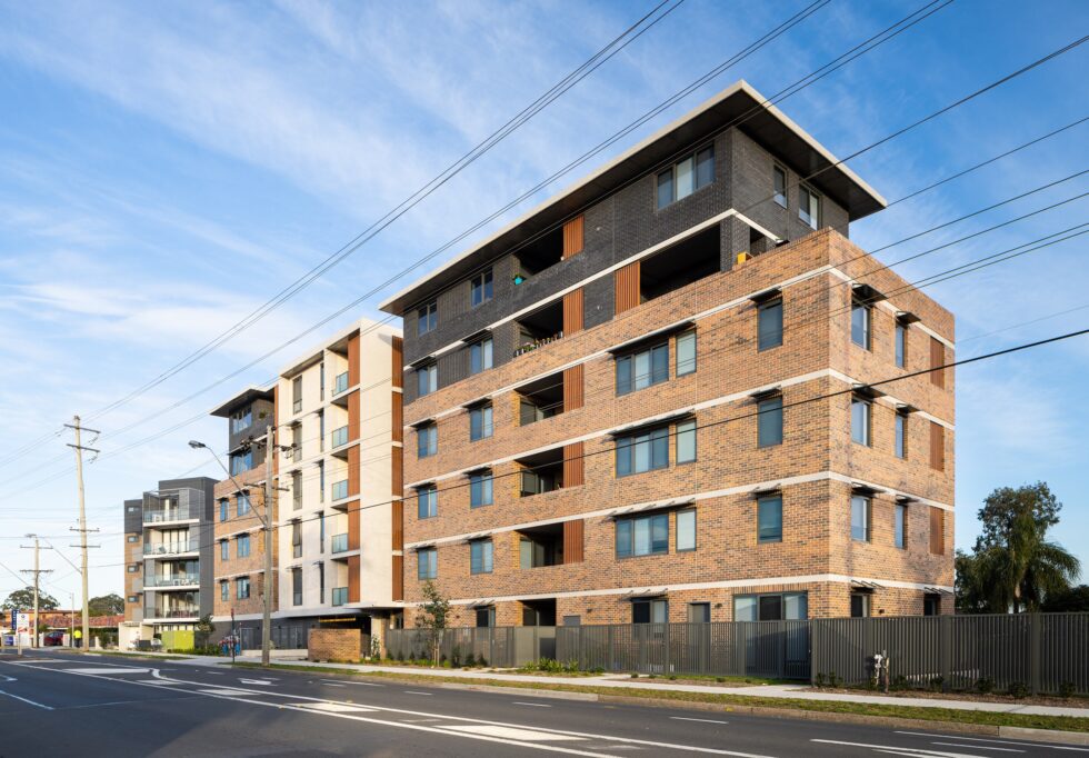 Wide six story building shown from the street