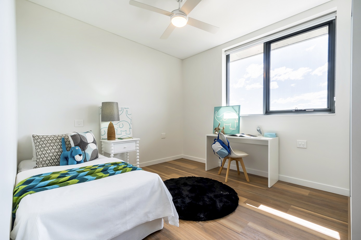 Indoor second bedroom of a unit with display furnishing