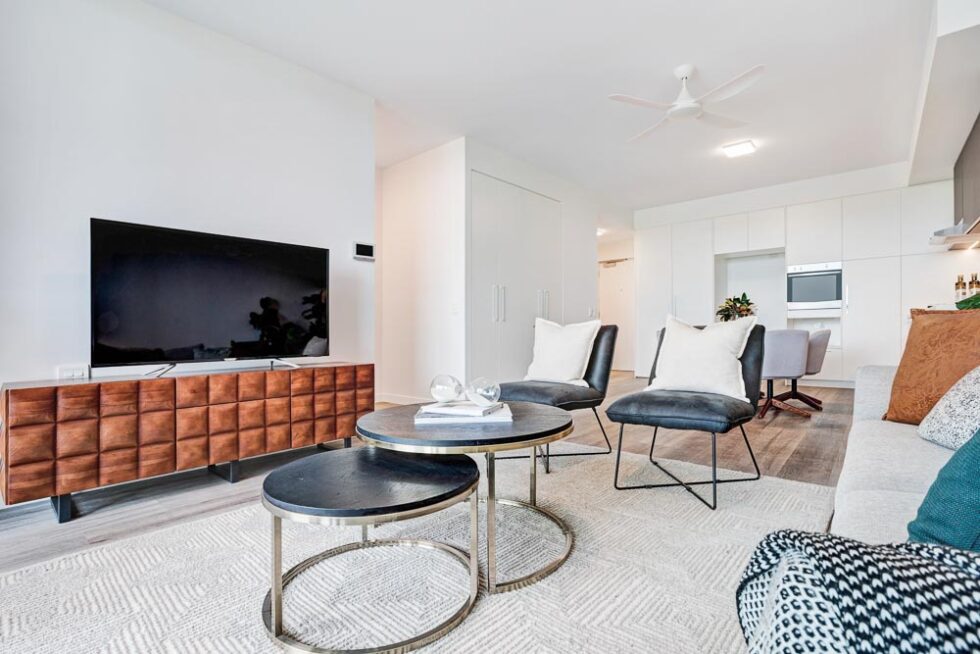 Lounge area of display furnished unit, looking back toward kitchen dining area