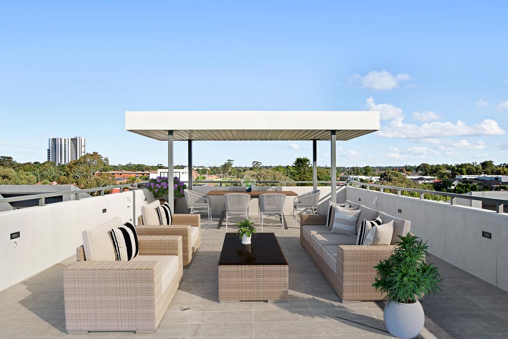 View from a rooftop entertainment area with display furnishing, covered and uncovered gathering spaces