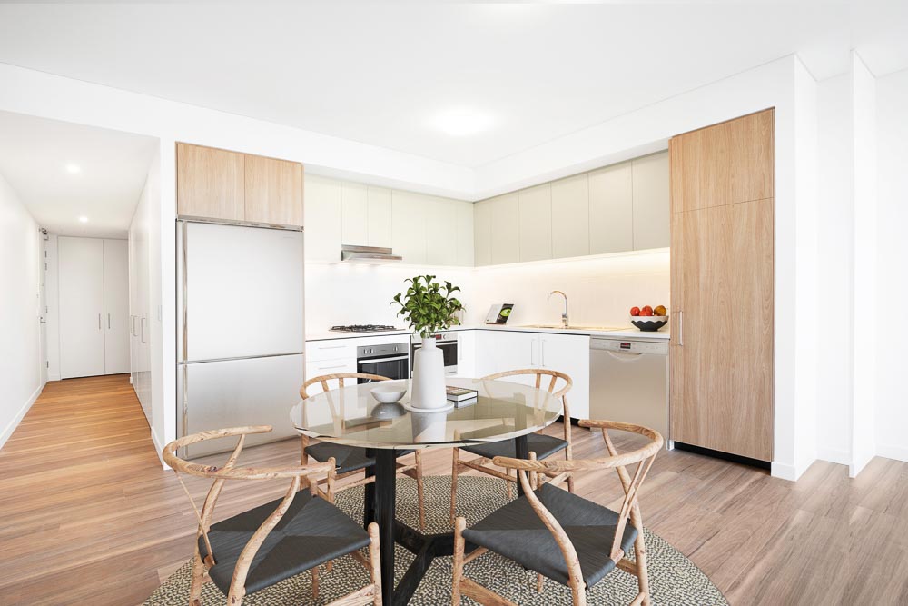 Indoor dining table and kitchen area of display furnished unit