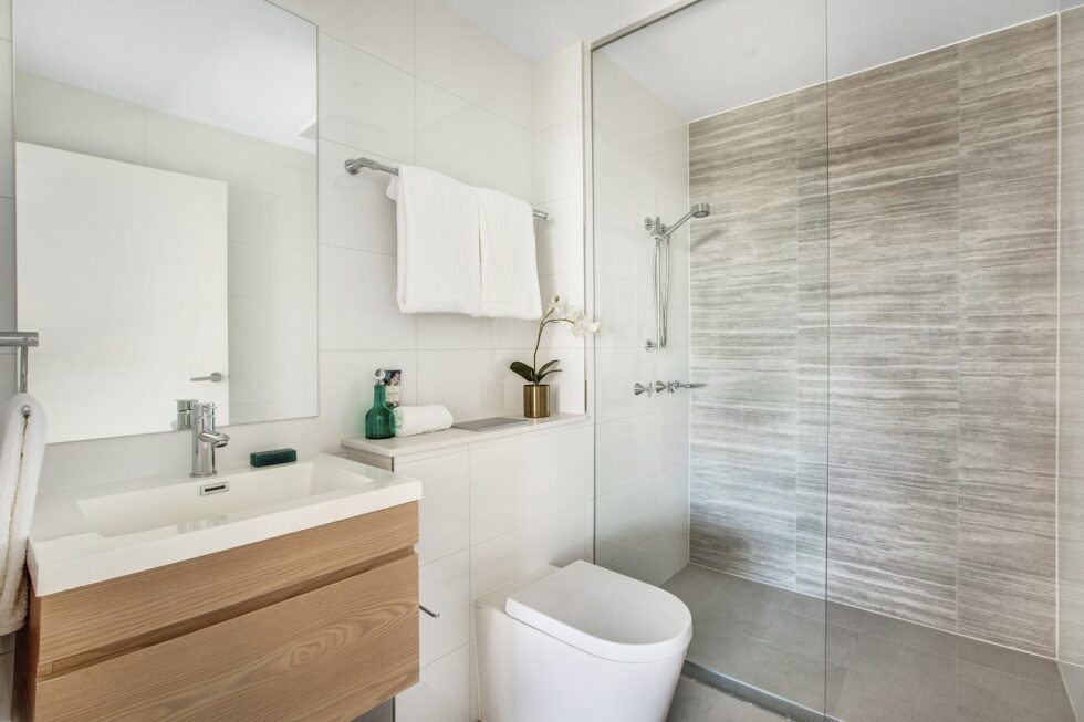 Bathroom of display furnished unit with spacious shower