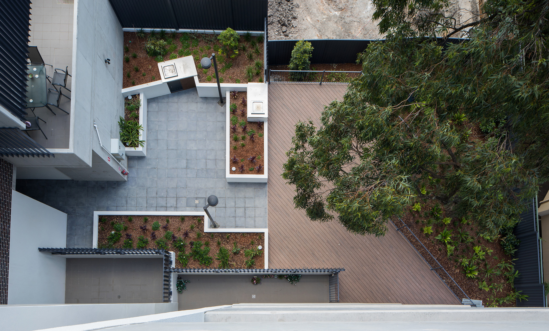 Top down view of building common area barbeque space and gardens