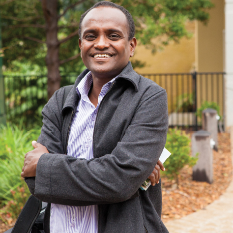 Smiling man standing outdoors in garden