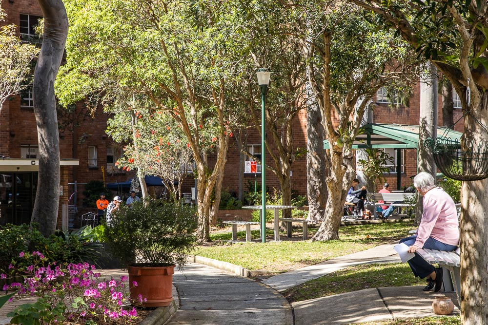 Community space with trees, gardens and footpaths