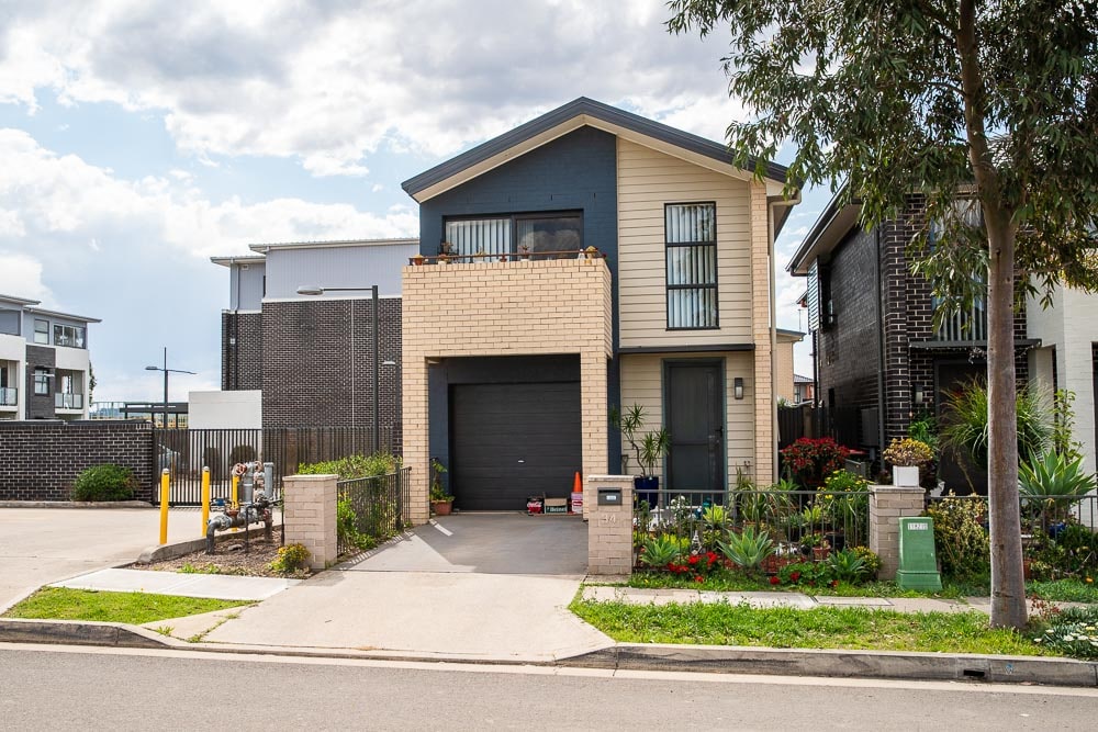 A two story home in Bonnyrigg coloured tan and dark grey