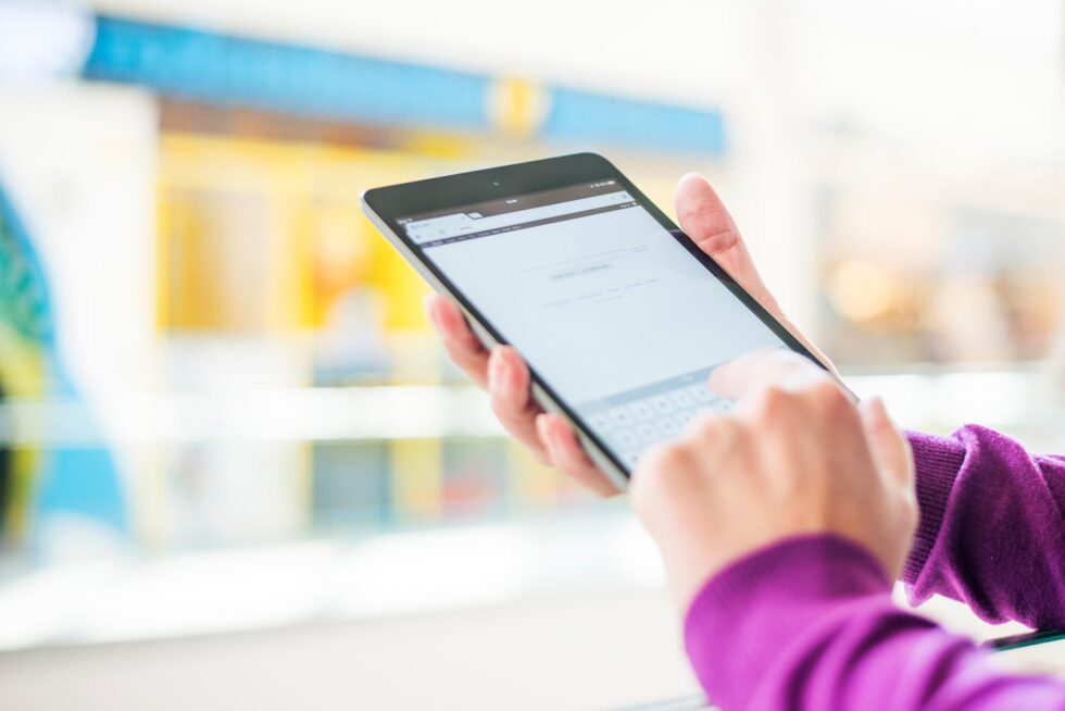 Close up of hands using a digital tablet