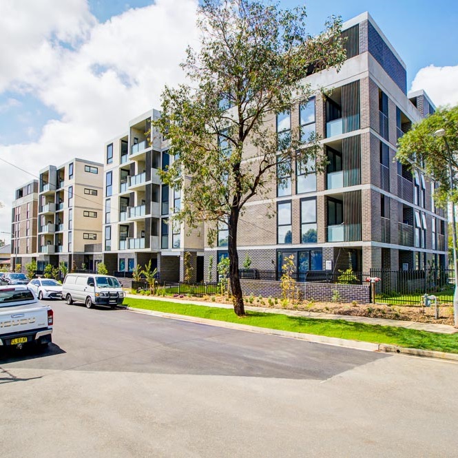 Five story building on a suburban street