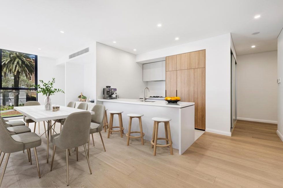 Dining room and kitchen area of a furnished unit