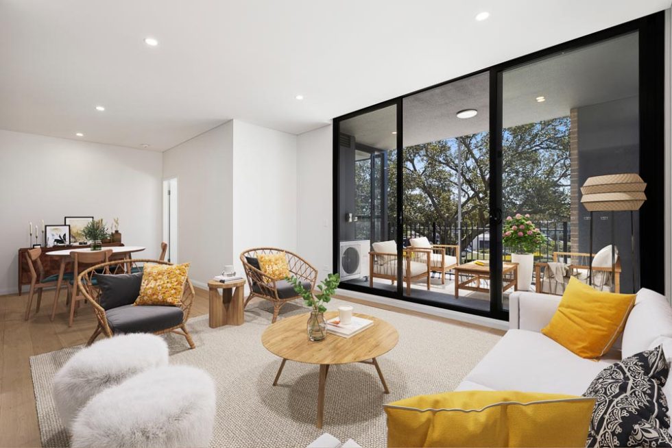 Living room of a furnished unit with a view out over the balcony