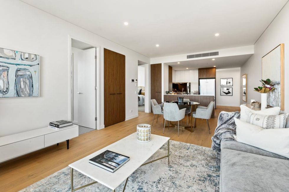 View through the lounge and dining area to kitchen of a dressed display unit