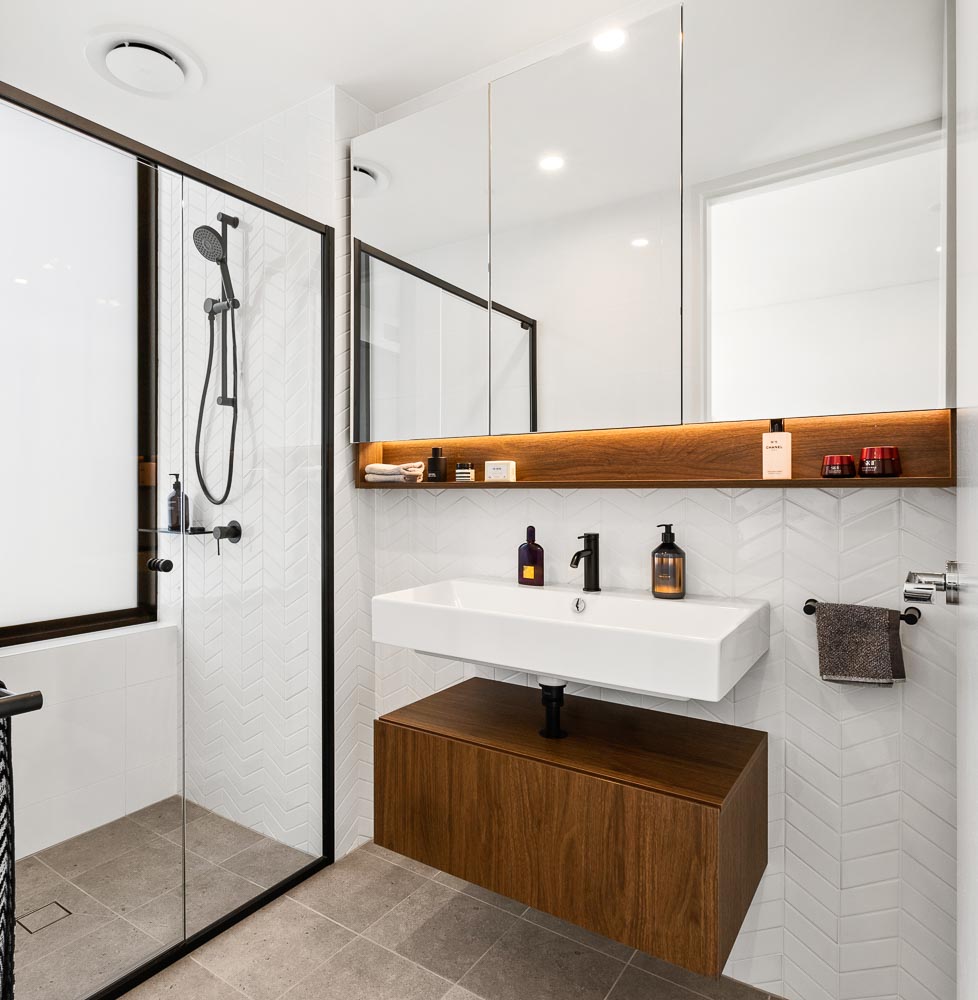 Bright and modern bathroom of a dressed display unit showing sink and shower