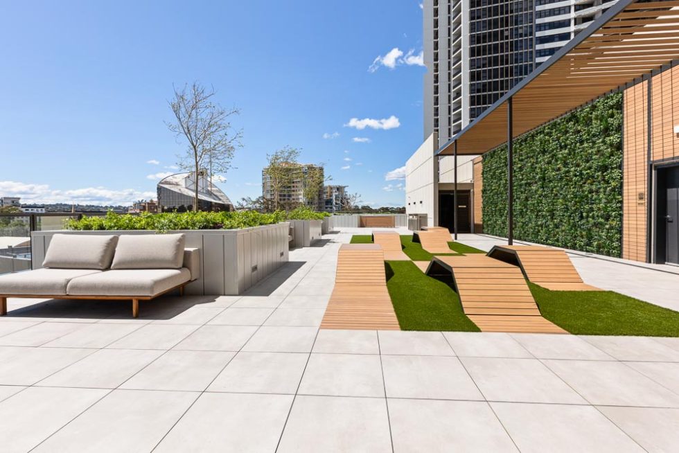 Rooftop entertainment area part way up a highrise building with seating area