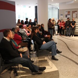 Attendees at SGCH's Redfern Sorry Day event seated around the foyer listening to presentations